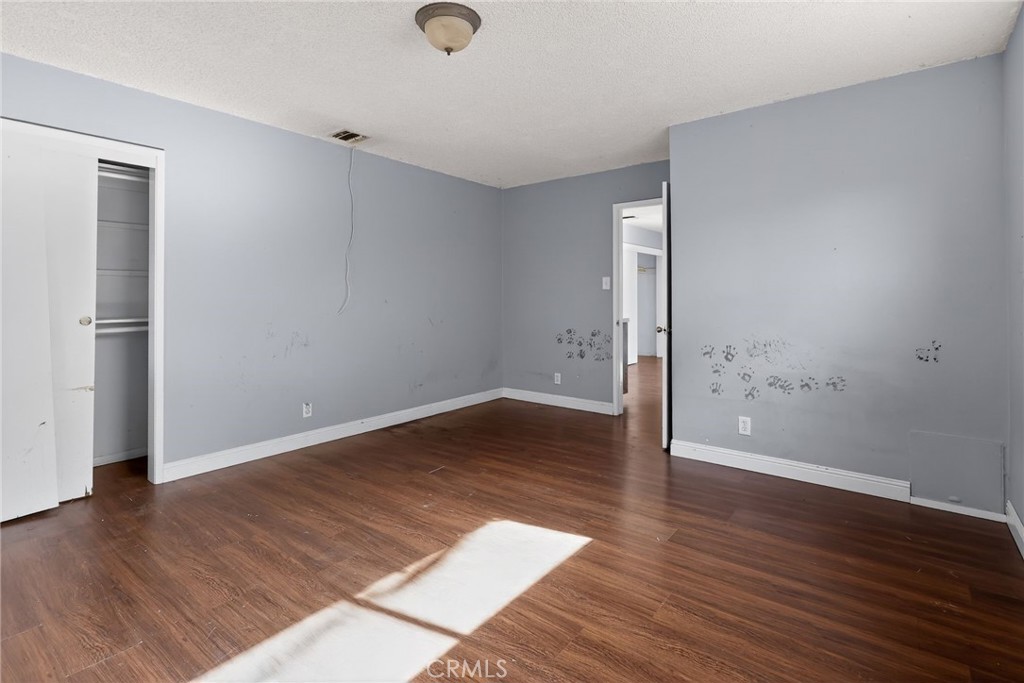 404 South 3rd Street Montebello, CA 90640 - Photo 16 of 29 an empty room with wooden floor and entrance