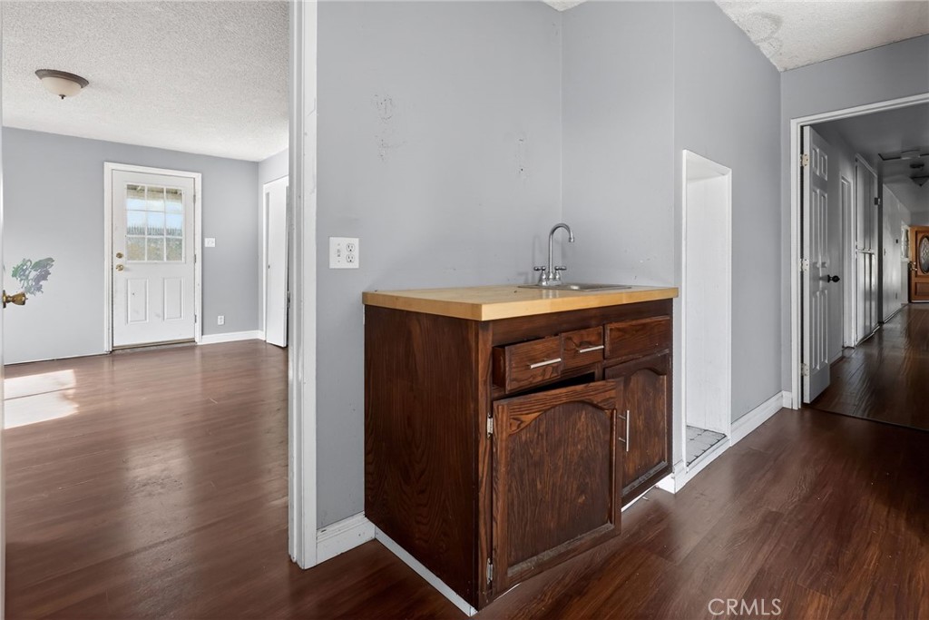 404 South 3rd Street Montebello, CA 90640 - Photo 17 of 29 a kitchen with wooden floor and sink