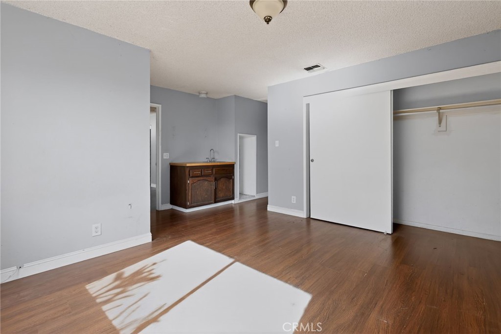 404 South 3rd Street Montebello, CA 90640 - Photo 19 of 29 a living room with wooden floor and fireplace