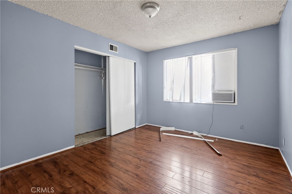 404 South 3rd Street Montebello, CA 90640 - Photo 20 of 29 an empty room with wooden floor and windows