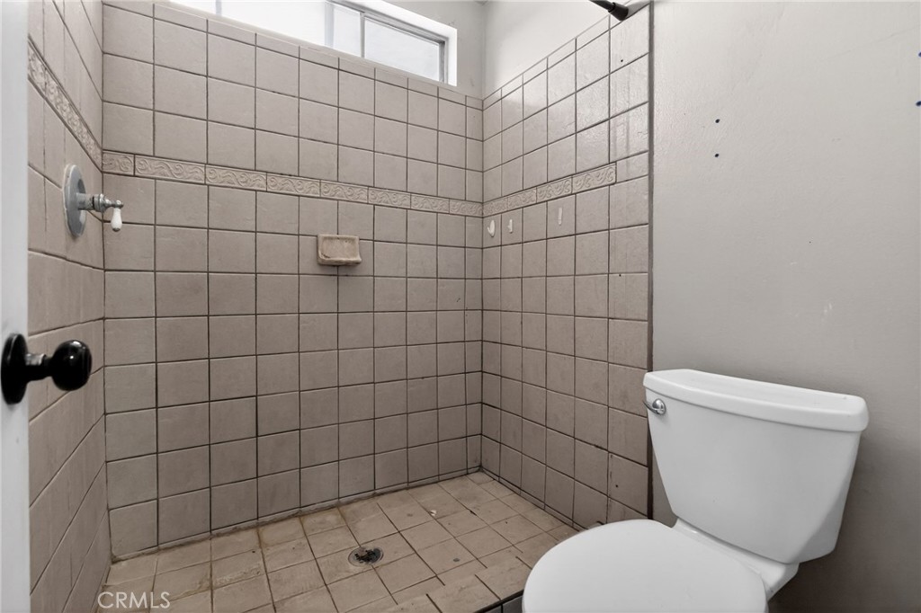 404 South 3rd Street Montebello, CA 90640 - Photo 22 of 29 a bathroom with a toilet and a shower