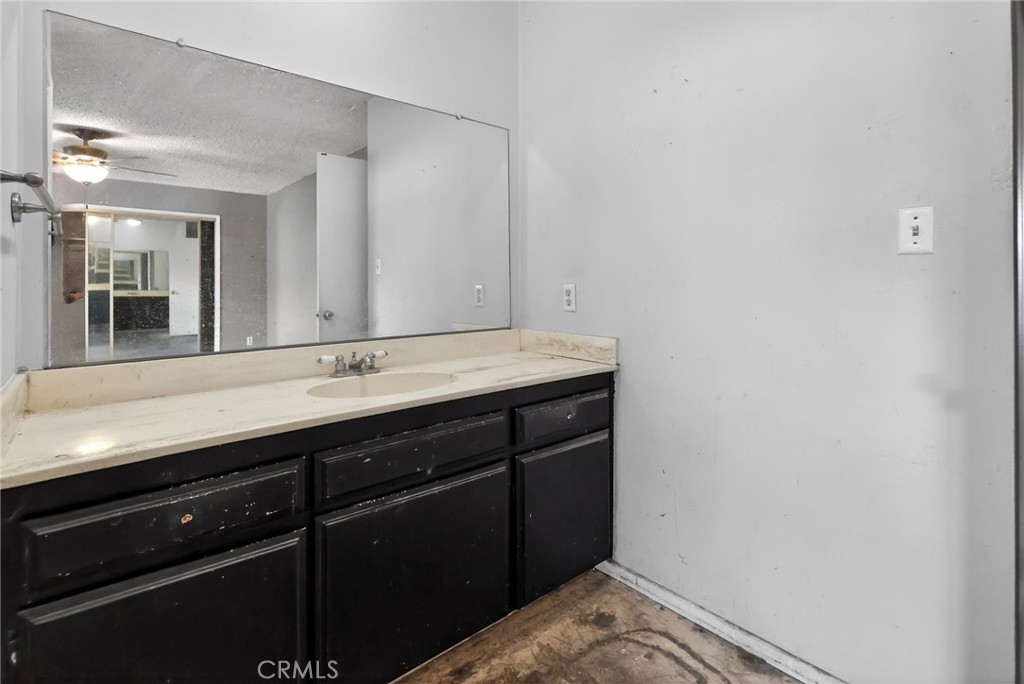 404 South 3rd Street Montebello, CA 90640 - Photo 23 of 29 a bathroom with a sink and a mirror