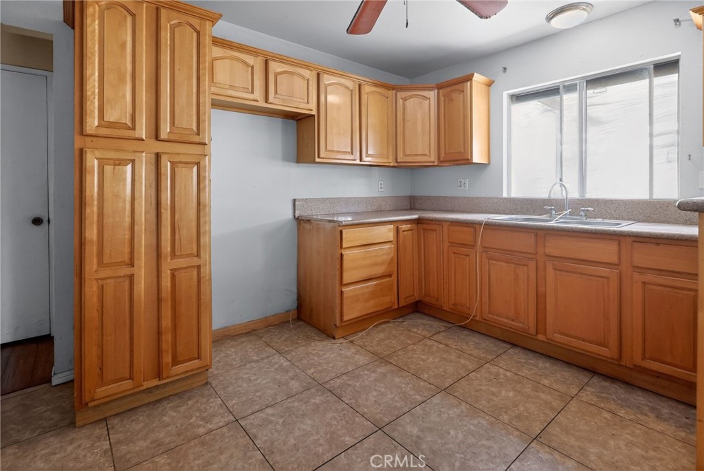404 South 3rd Street Montebello, CA 90640 - Photo 5 of 29 a kitchen with stainless steel appliances granite countertop a sink and cabinets