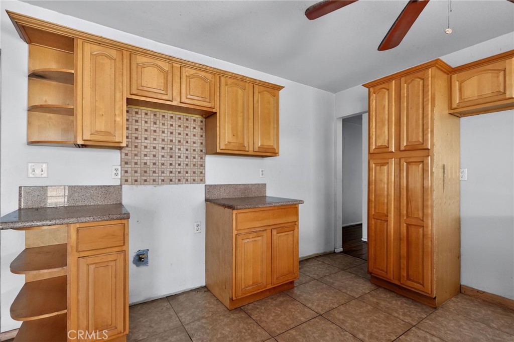 404 South 3rd Street Montebello, CA 90640 - Photo 9 of 29 a kitchen with stainless steel appliances granite countertop a refrigerator and a stove