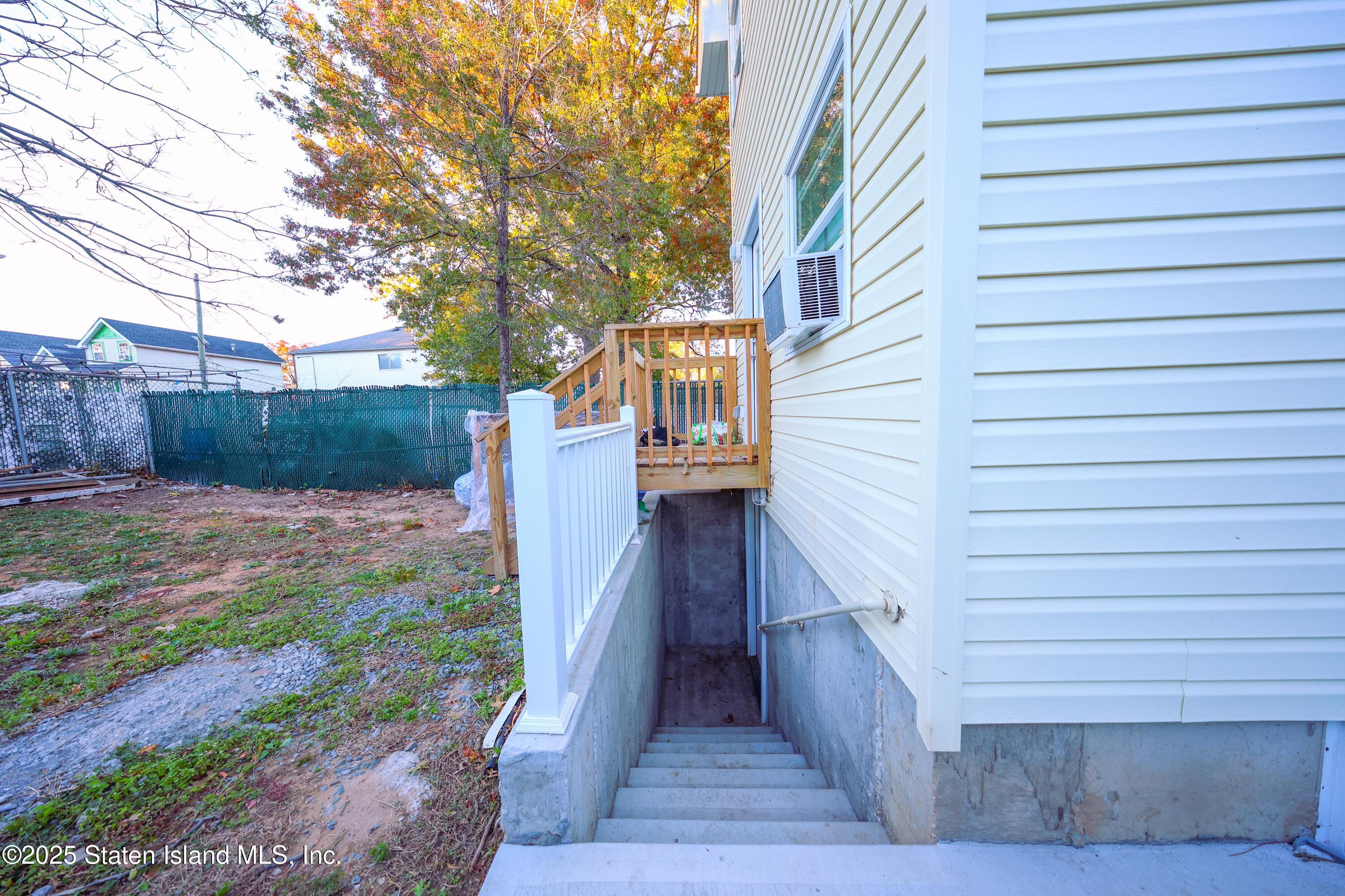 76 Simonson Avenue Staten Island, NY 10303 - Photo 19 of 21 a view of a wooden fence and a pathway