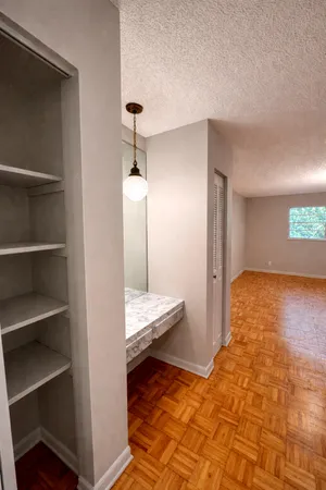 a view of a hallway with a dining room