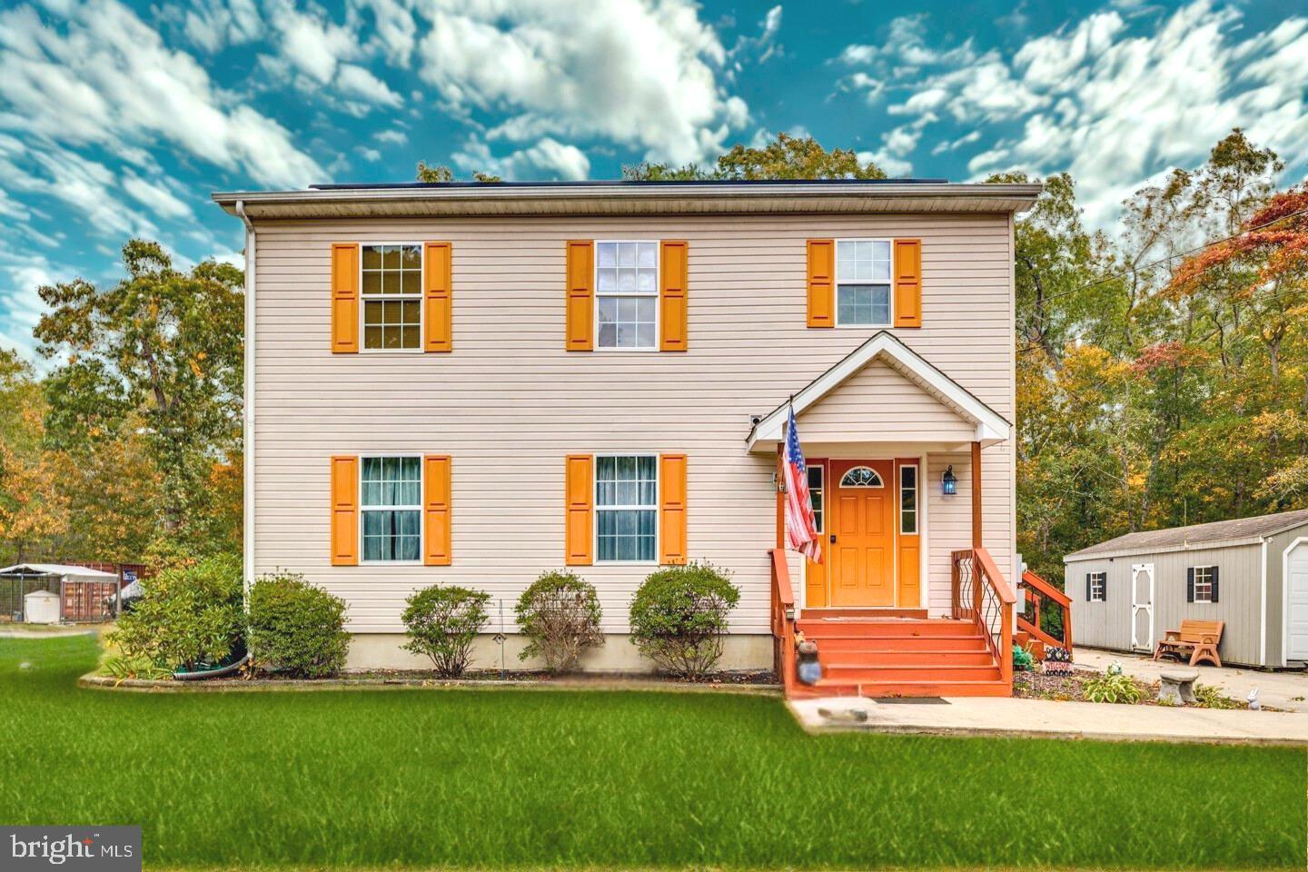 33 Laurel Road Millville, NJ 08332 - Photo 1 of 37 a front view of a house with a yard and garage