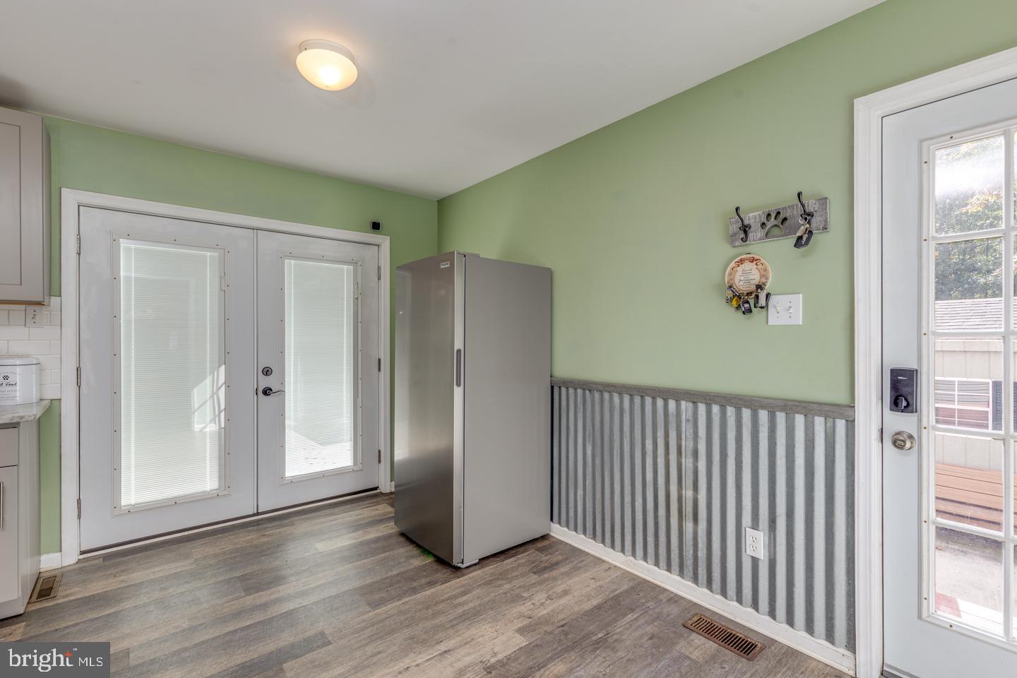 33 Laurel Road Millville, NJ 08332 - Photo 16 of 37 an empty room with wooden floor windows and entryway