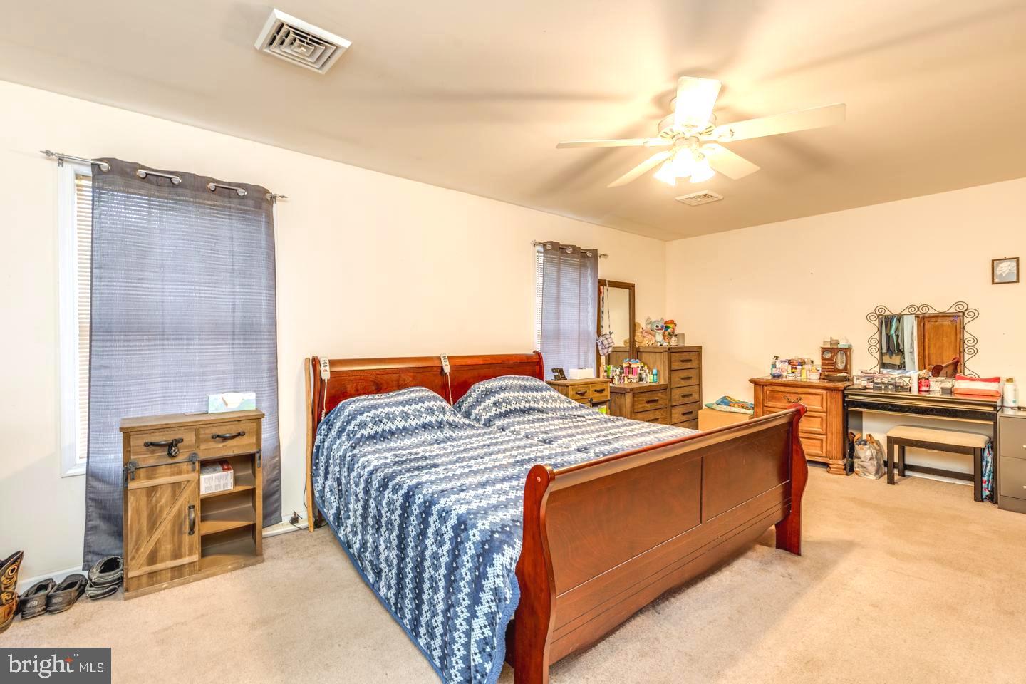 33 Laurel Road Millville, NJ 08332 - Photo 19 of 37 a bedroom with a bed and a chandelier