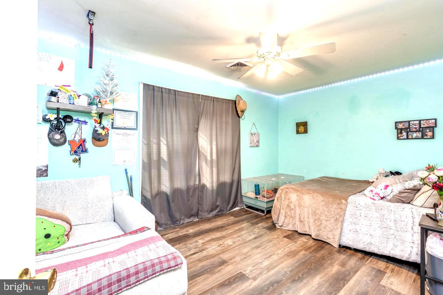 33 Laurel Road Millville, NJ 08332 - Photo 23 of 37 a bedroom with a bed and a chandelier