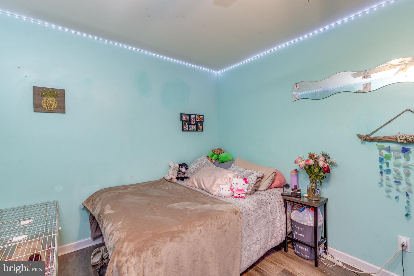 33 Laurel Road Millville, NJ 08332 - Photo 24 of 37 a bedroom with a bed and chandelier