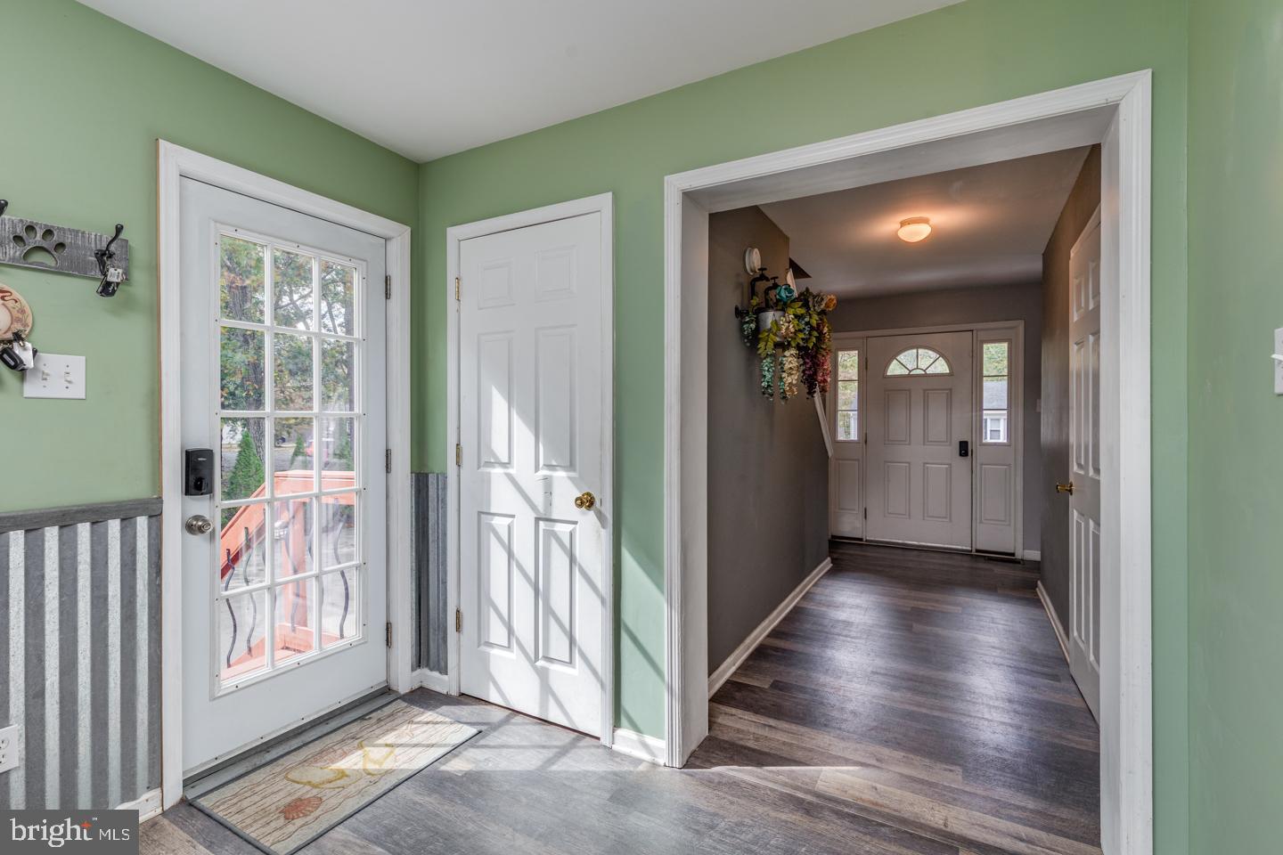 33 Laurel Road Millville, NJ 08332 - Photo 6 of 37 a view of a hallway view with wooden floor and entryway