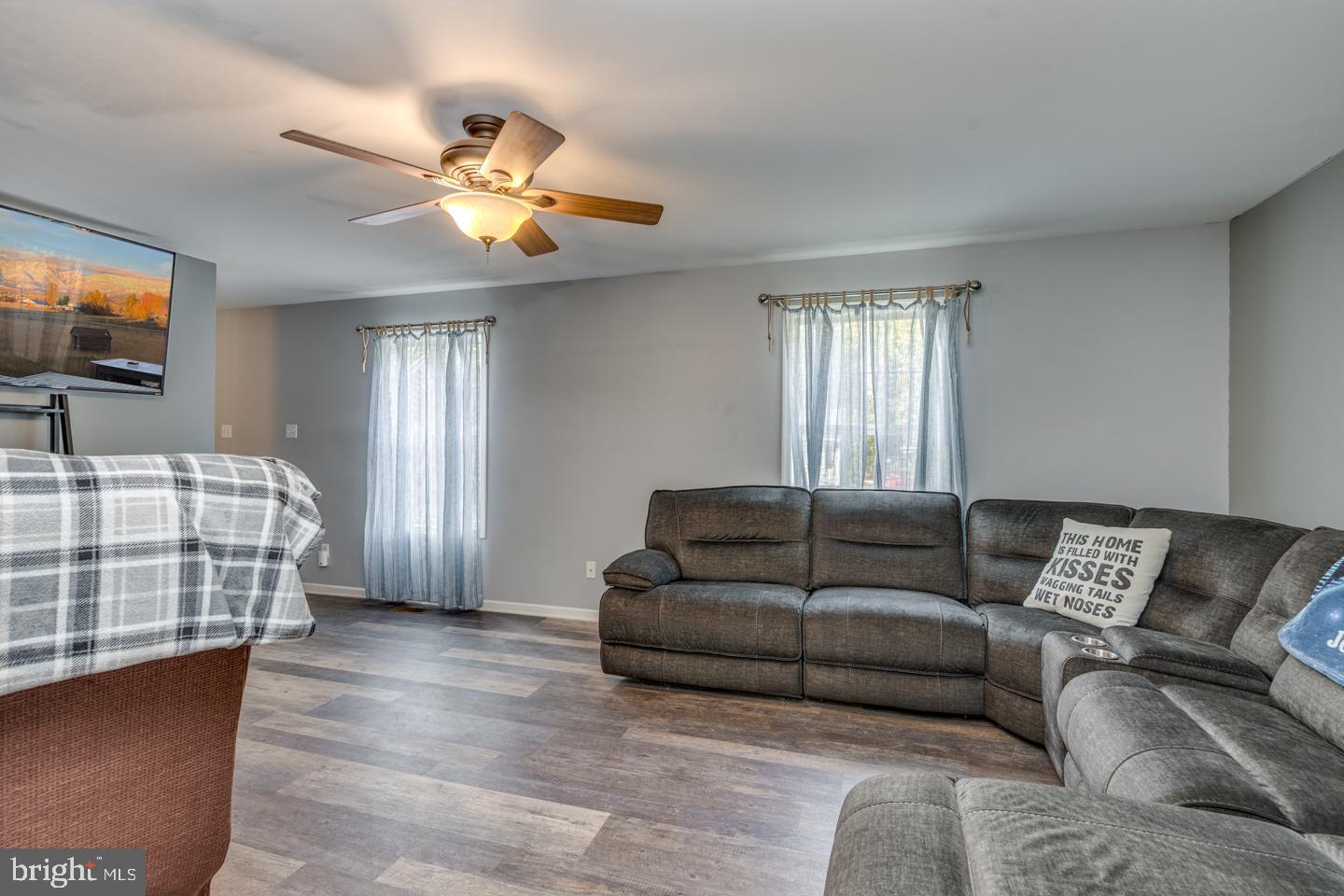 33 Laurel Road Millville, NJ 08332 - Photo 7 of 37 a living room with furniture and a flat screen tv