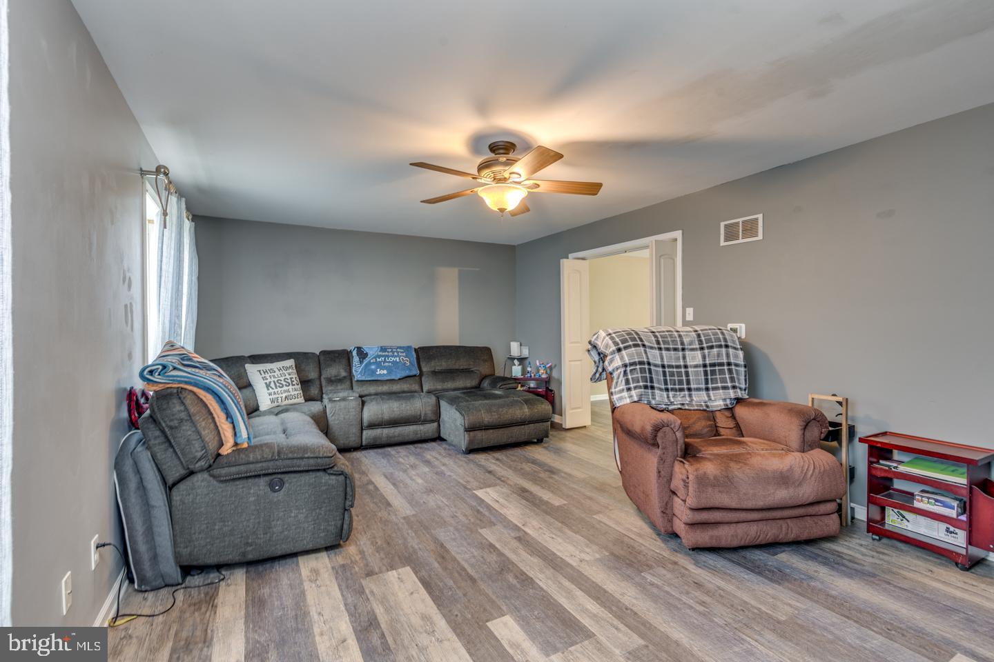 33 Laurel Road Millville, NJ 08332 - Photo 8 of 37 a living room with furniture and a wooden floor