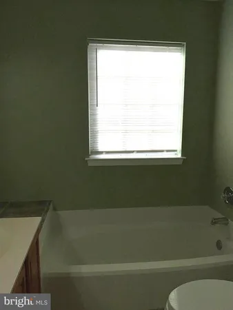 a bathroom with a shower and a bathtub