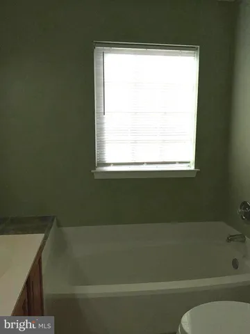 a bathroom with a shower and a bathtub