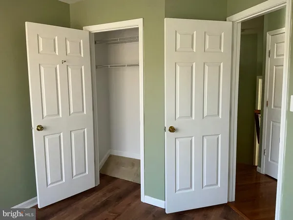 an entryway with wooden floor
