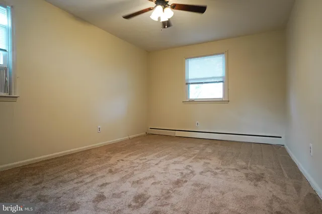 a bathroom with a toilet and a bathtub