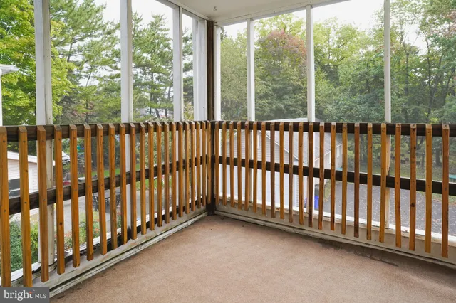 a backyard of a house with barbeque oven table and chairs