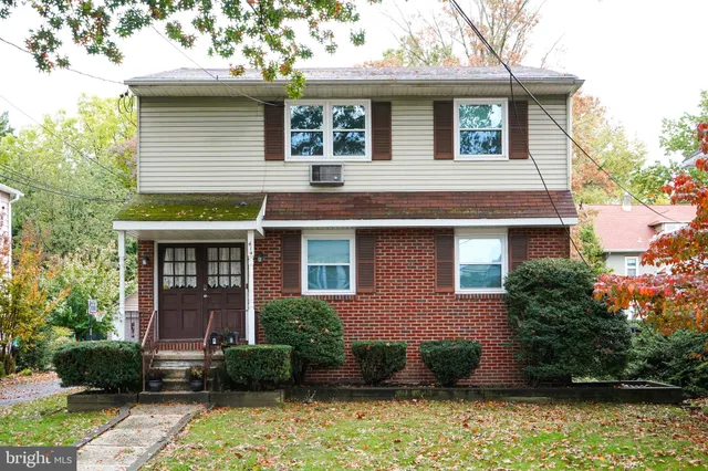 front view of a house with a street