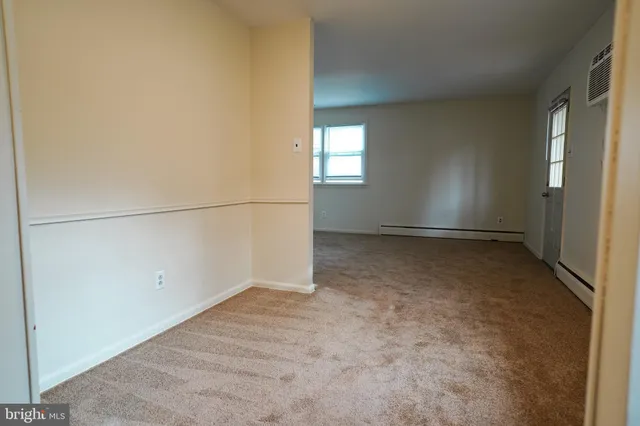 a view of a room that has a window in it