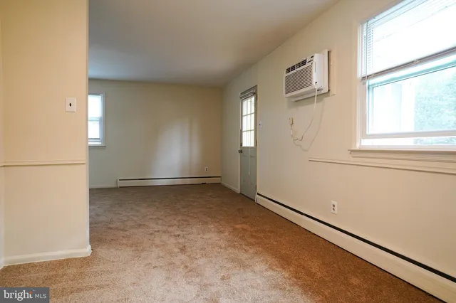 a kitchen with cabinets and stainless steel appliances