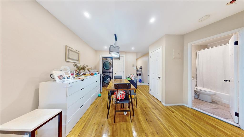 9729 4th Avenue, Unit 3C Brooklyn, NY 11209 - Photo 5 of 10 a very nice looking room with a large bed a desk and chair