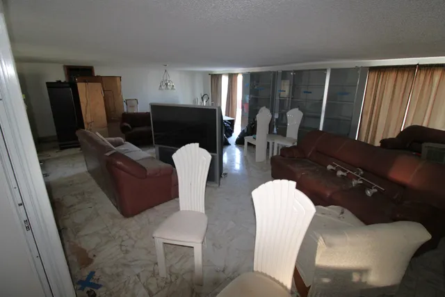 a backyard of a house with outdoor seating