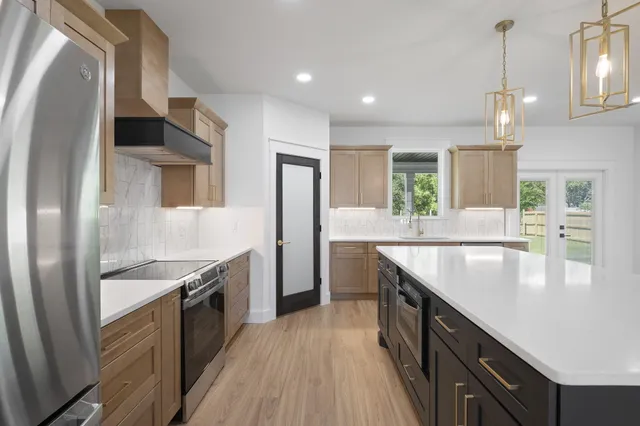 a kitchen with a sink and cabinets