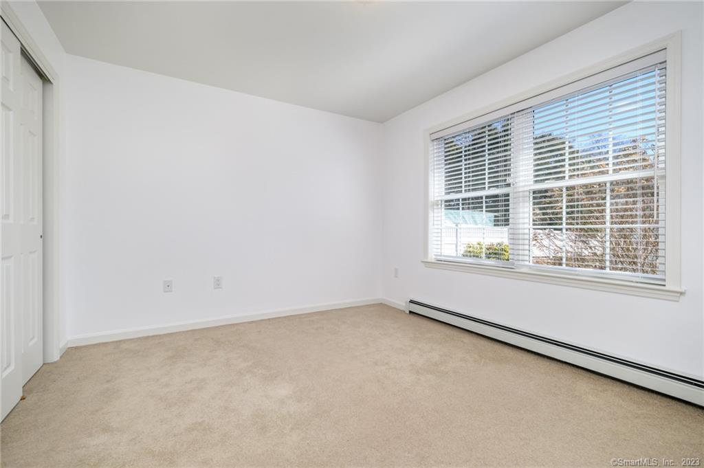 217 Highlawn Road Fairfield, CT 06824 - Photo 12 of 27 an empty room with a window