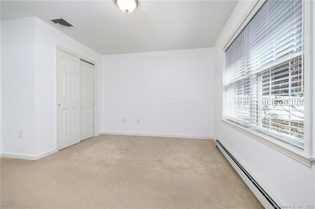 217 Highlawn Road Fairfield, CT 06824 - Photo 13 of 27 a view of an empty room with a window
