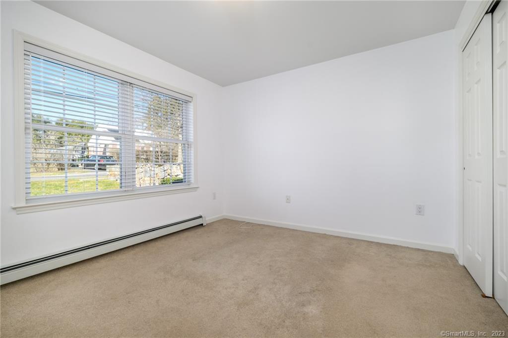 217 Highlawn Road Fairfield, CT 06824 - Photo 16 of 27 an empty room with a window