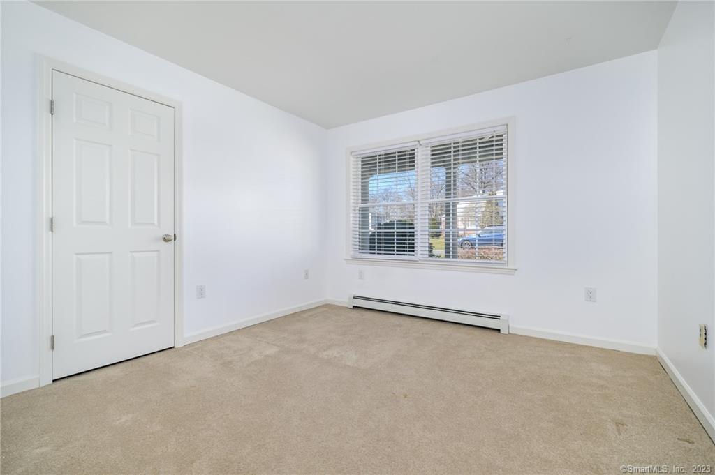 217 Highlawn Road Fairfield, CT 06824 - Photo 18 of 27 an empty room with windows