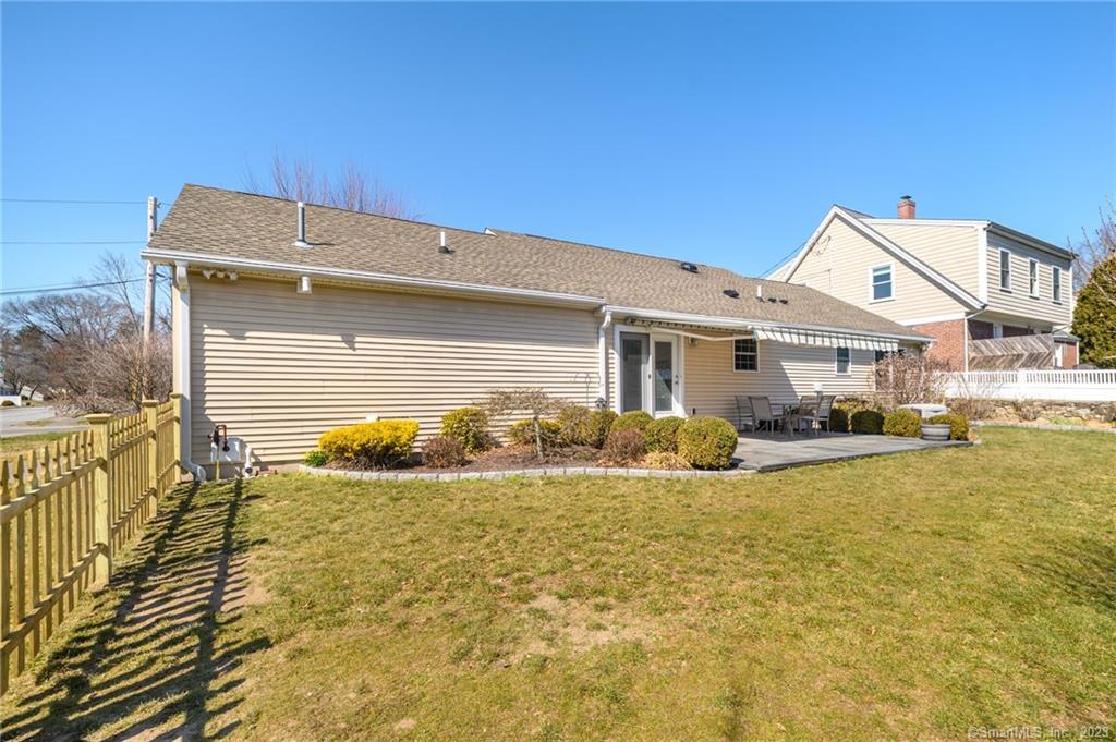 217 Highlawn Road Fairfield, CT 06824 - Photo 25 of 27 a front view of a house with swimming pool