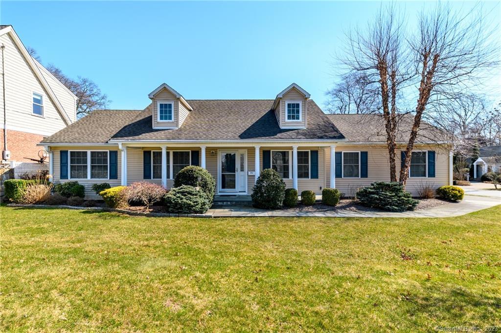 217 Highlawn Road Fairfield, CT 06824 - Photo 27 of 27 a front view of a house with swimming pool and porch with furniture