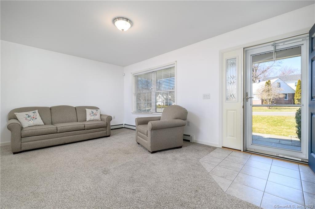 217 Highlawn Road Fairfield, CT 06824 - Photo 4 of 27 a living room with furniture and a window