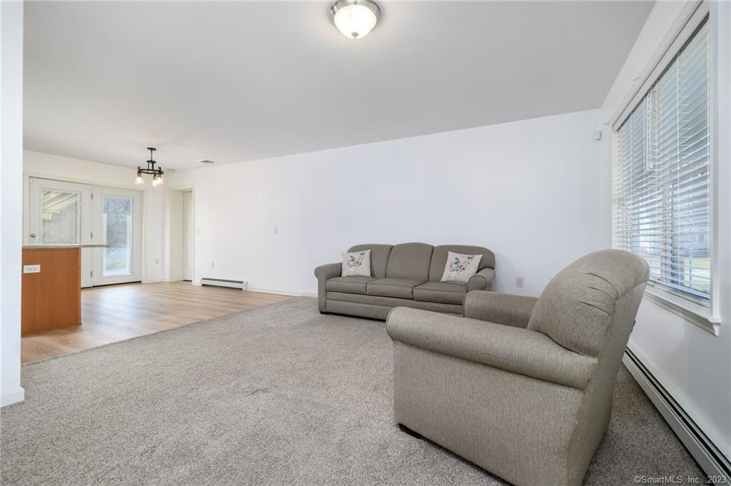 217 Highlawn Road Fairfield, CT 06824 - Photo 6 of 27 a living room with furniture and a couch
