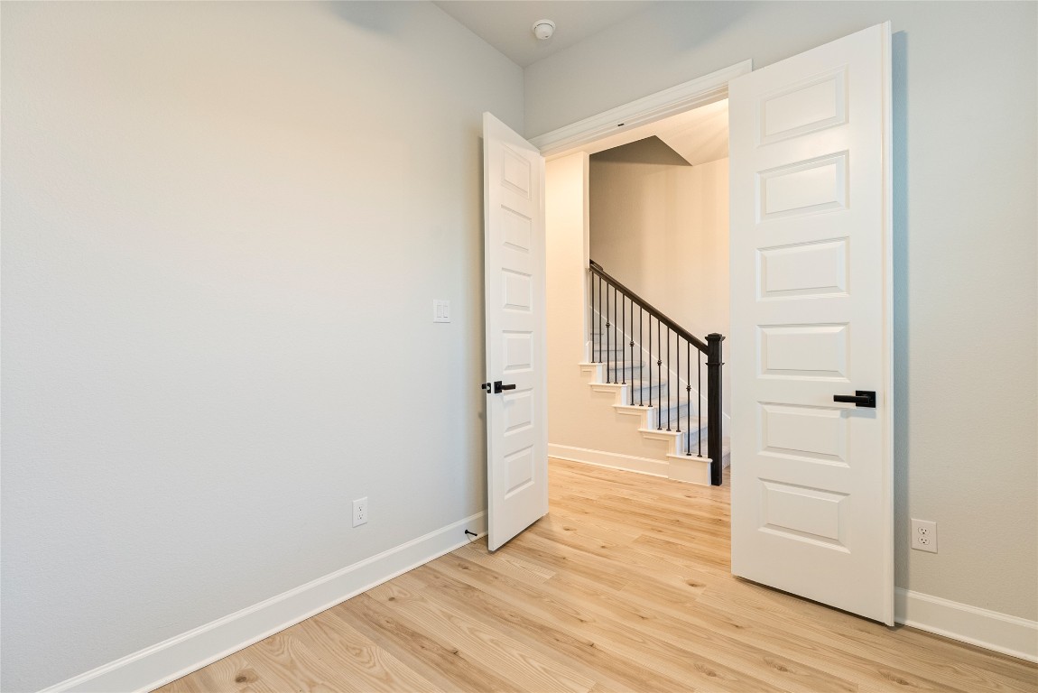 17113 Howdy Way Manor, TX 78653 - Photo 13 of 25 a view of an entryway with wooden floor