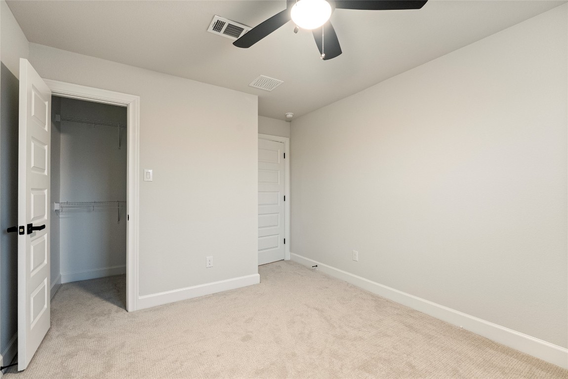 17113 Howdy Way Manor, TX 78653 - Photo 23 of 25 an empty room with chandelier fan