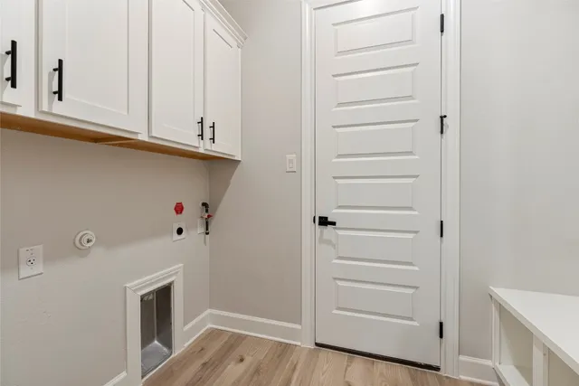 a kitchen with stainless steel appliances granite countertop a sink a stove a microwave and wooden cabinets