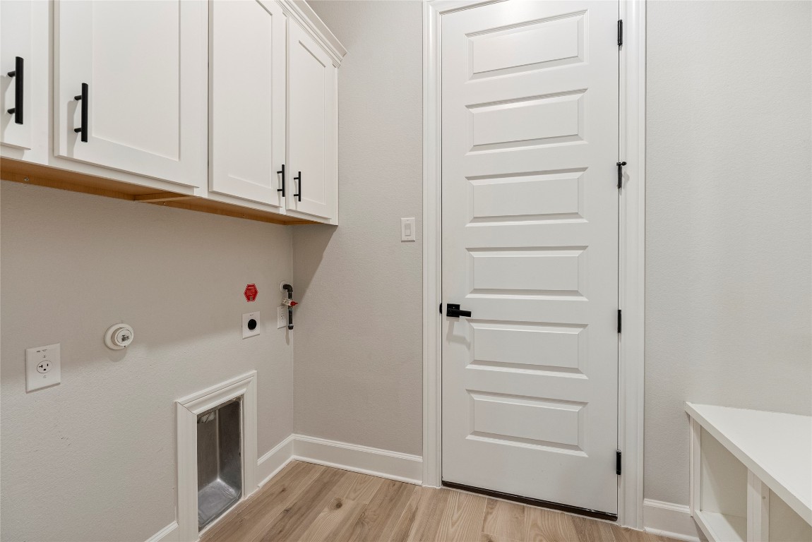17113 Howdy Way Manor, TX 78653 - Photo 5 of 25 a view of cabinets and wooden floor