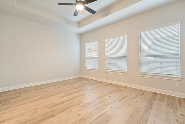 a view of cabinets and wooden floor