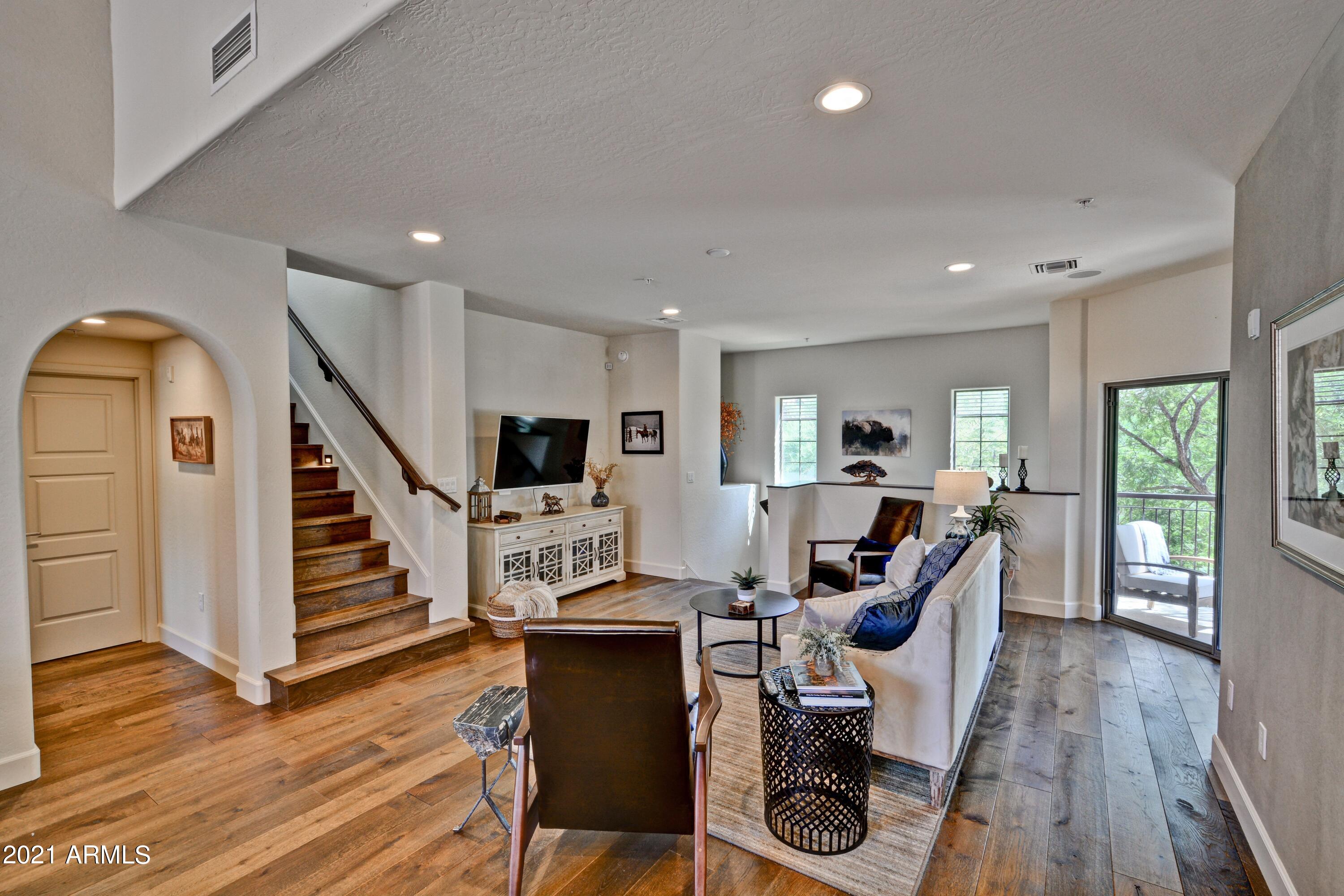 3935 East Rough Rider Road, Unit 1360 Phoenix, AZ 85050 - Photo 1 of 43 AVIANO Great Room towards stairs