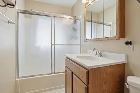 a bathroom with a sink and mirror