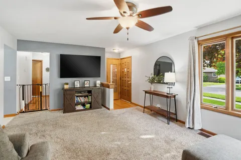 a view of a livingroom with furniture and a flat screen tv