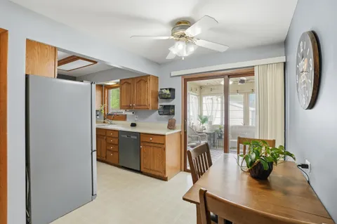 a kitchen with sink and refrigerator