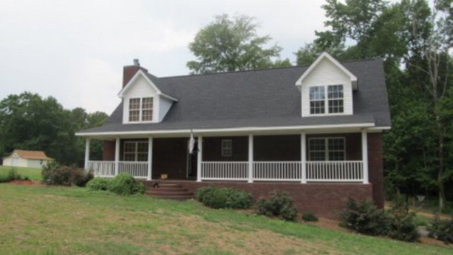 6555 Barfield Road Macon, GA 31216 - Photo 1 of 1 a front view of a house with a yard and porch