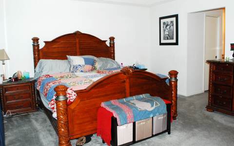 96456 Chester Road Yulee, FL 32097 - Photo 7 of 21 a bedroom with a bed and a lamp