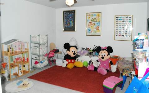 96456 Chester Road Yulee, FL 32097 - Photo 10 of 21 a bedroom with furniture and a baby crib