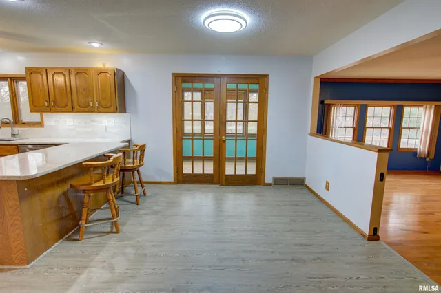 $300,000 | 591 Breezy Point Drive, Clinton, IA 52732